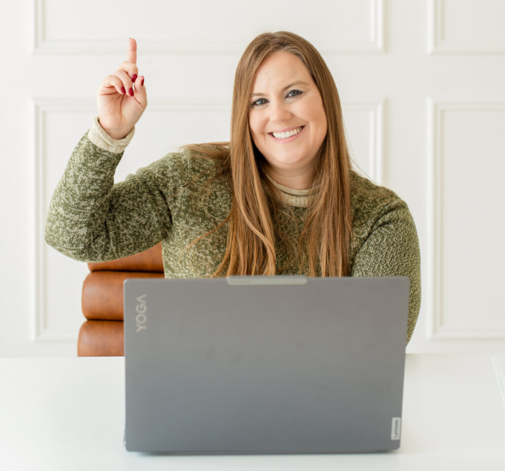 Whitney Goulish from WGB pointing to their mission statement