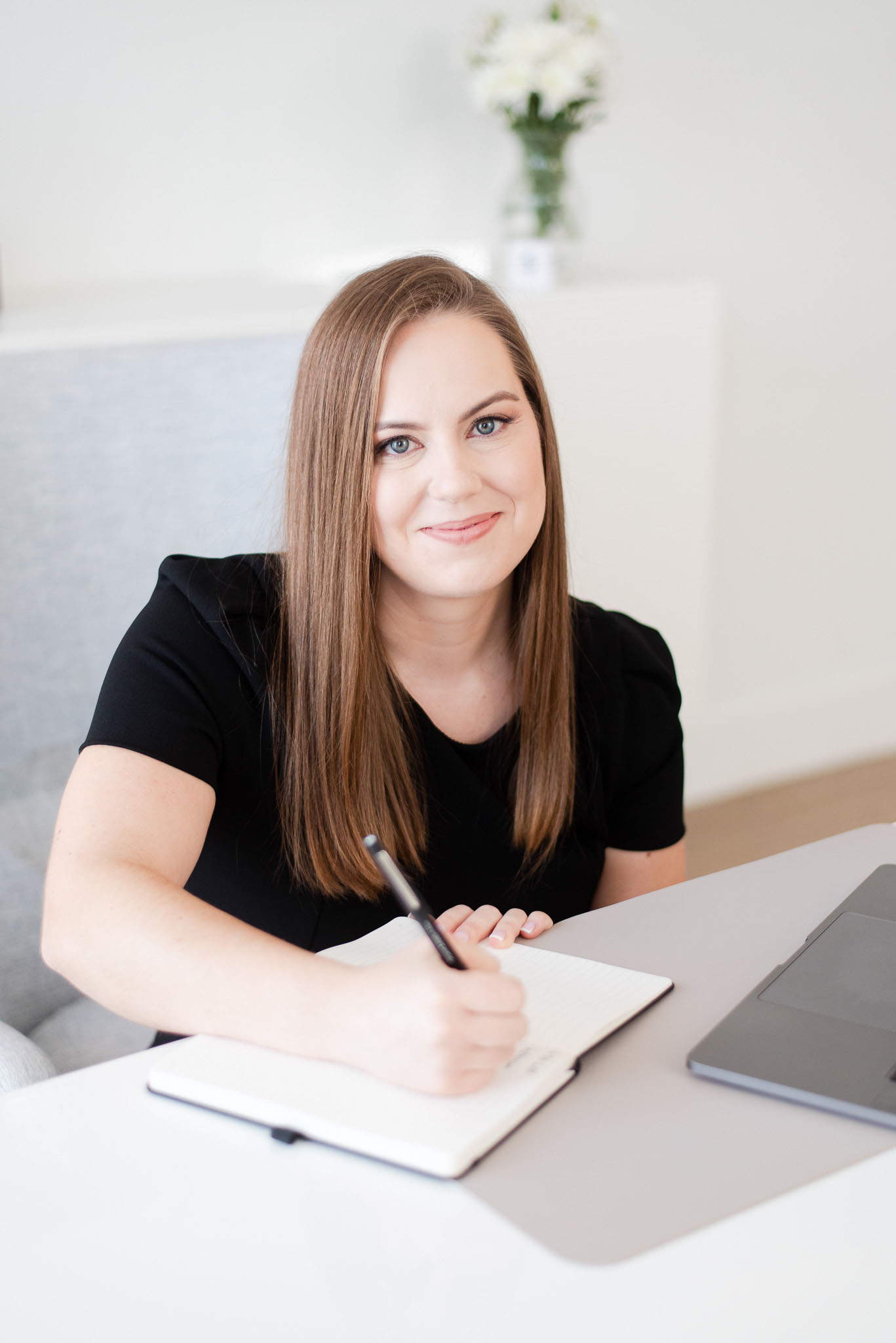 Photo of Whitney Goulish, writing (D750)