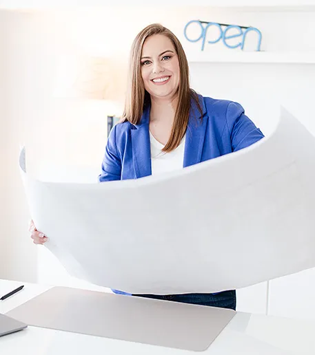 Whitney-COO-Holding-Blueprint-M-Suarez-Photography-74_cropped_v4 Whitney Holding Blueprint Over Desk