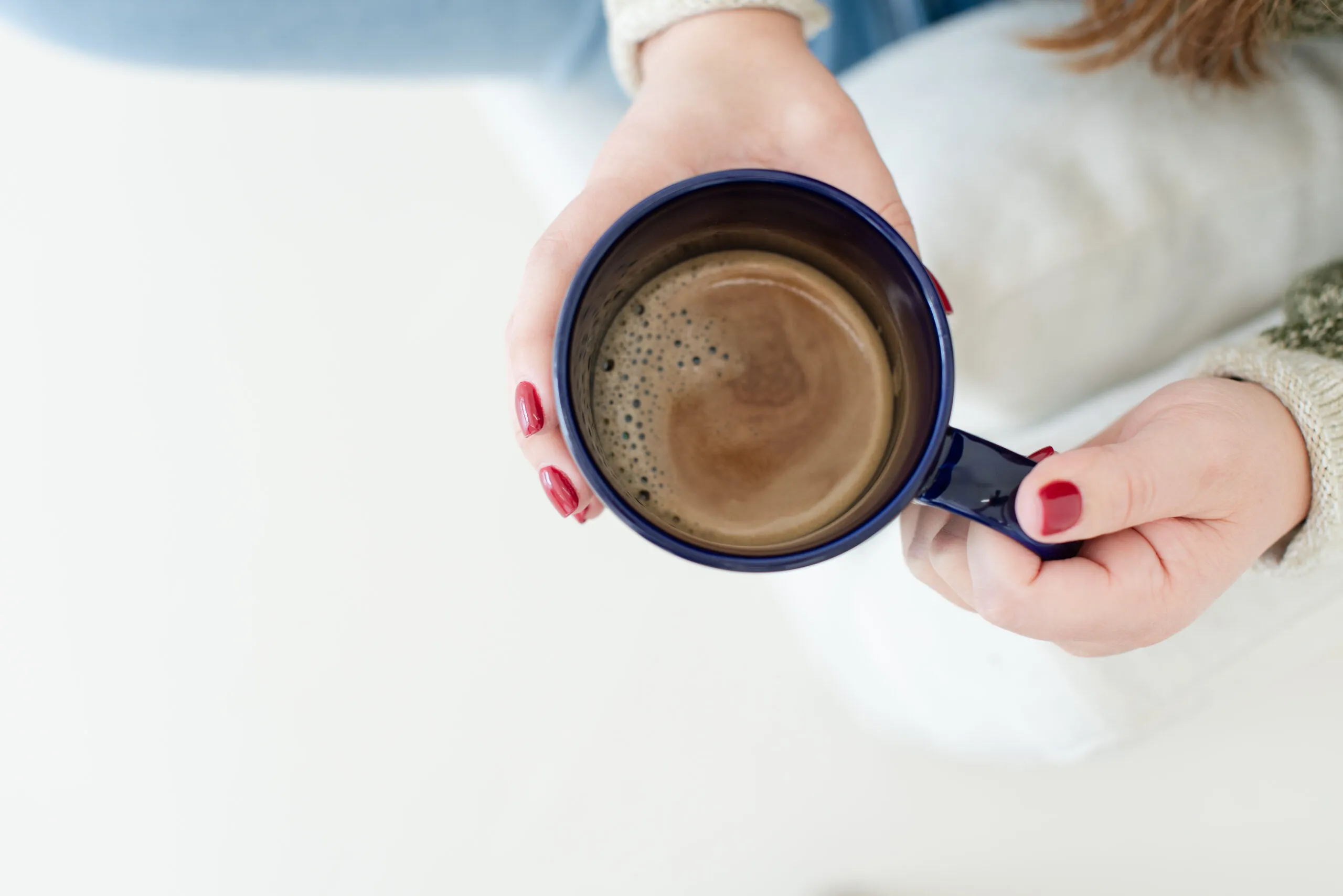 person holding a coffee cup