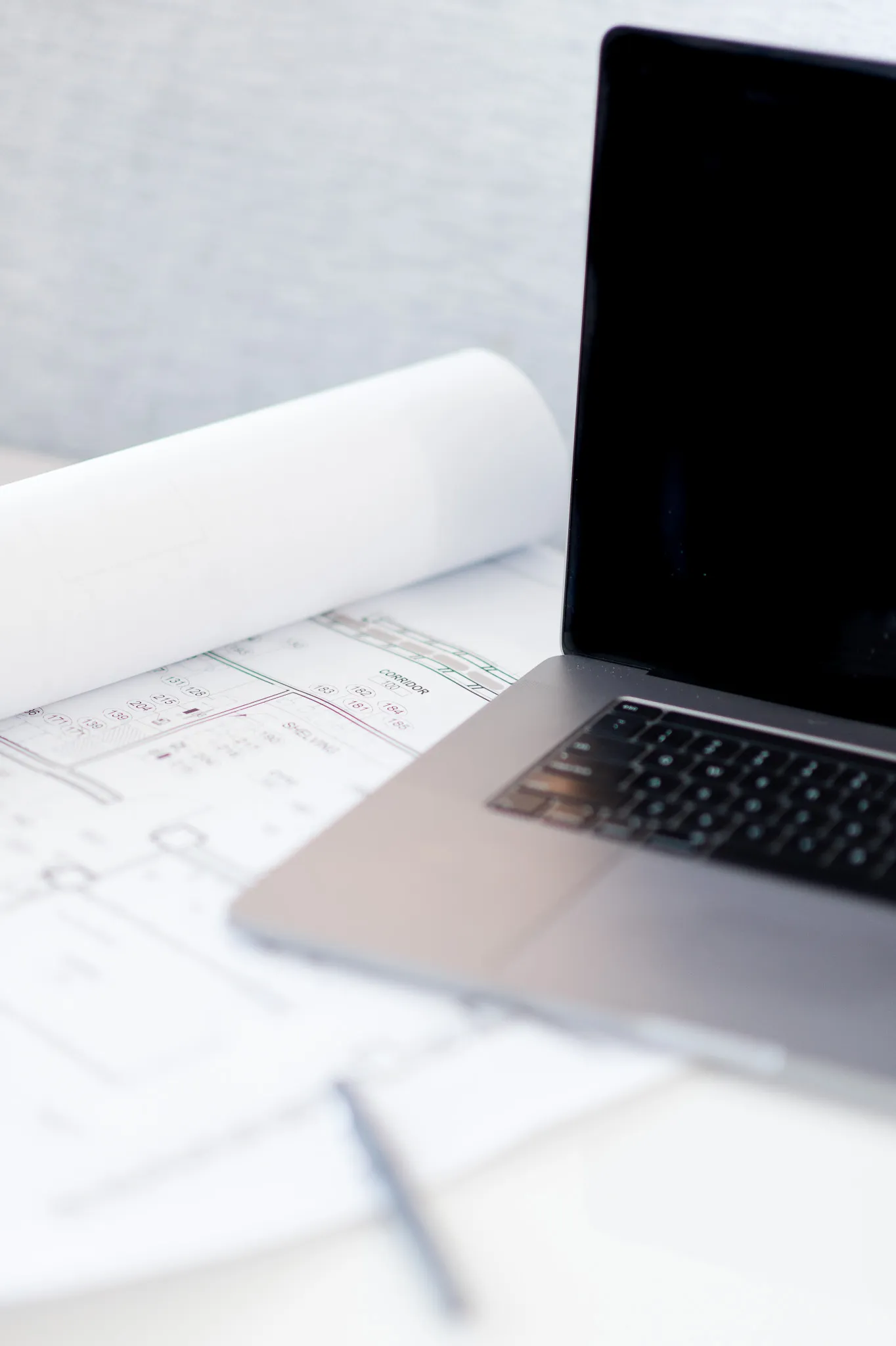 Laptop Sitting on Blueprint