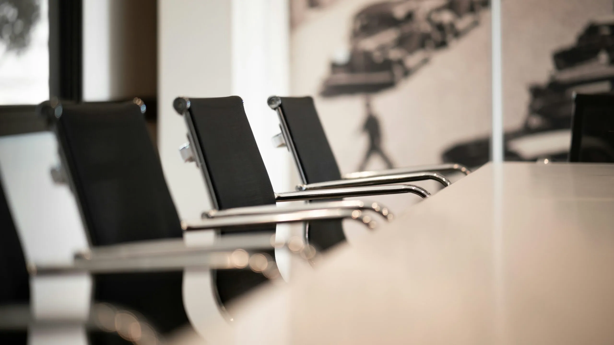 Meeting Table with Black and Silver Chairs