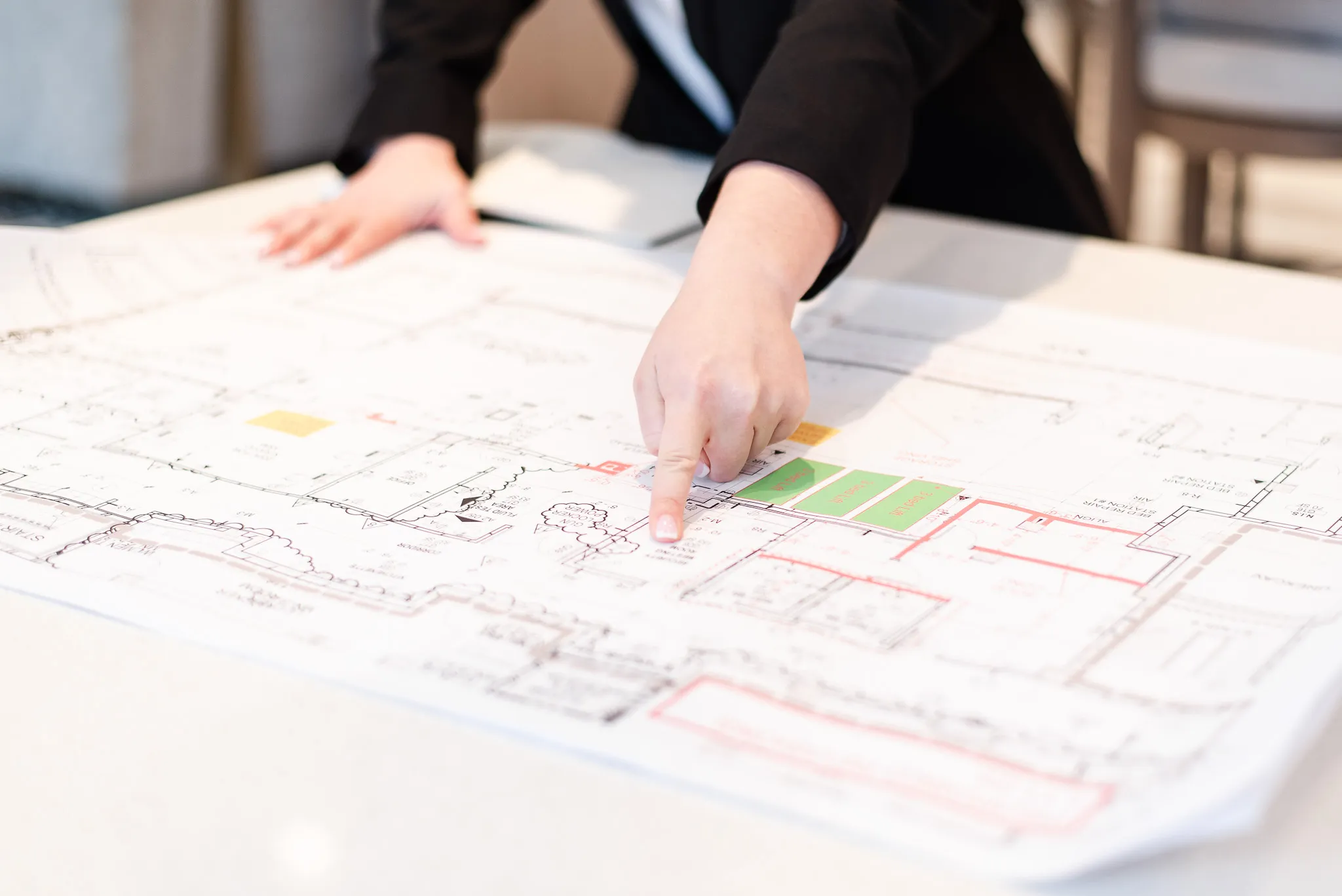 Whitney's Hands Pointing at Location on a Blueprint Whitney's Hands Pointing at Location on a Blueprint