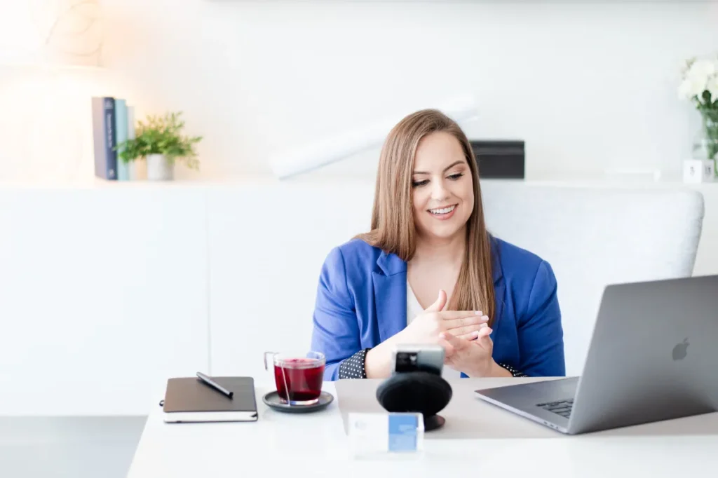 Whitney Goulish, President & Founder on a virtual call with a client