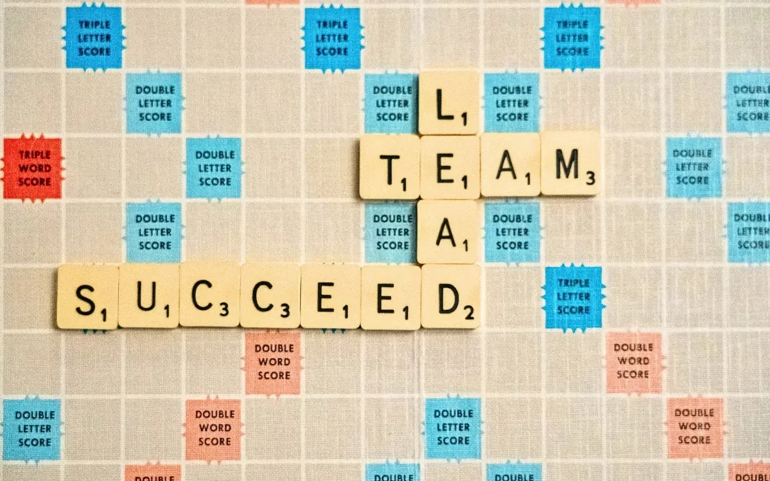 Team Lead Succeed Spelled Out on Scrabble-Type Board - Nick Fewings/Unsplash
