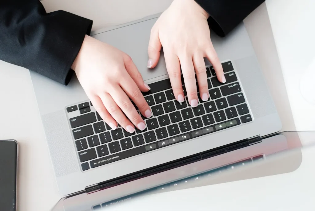 Person typing on a laptop