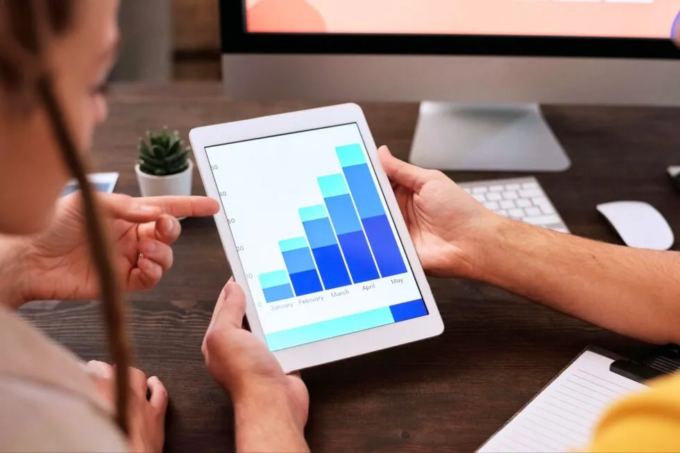 Tablet with Graph Examining Data Analytics
