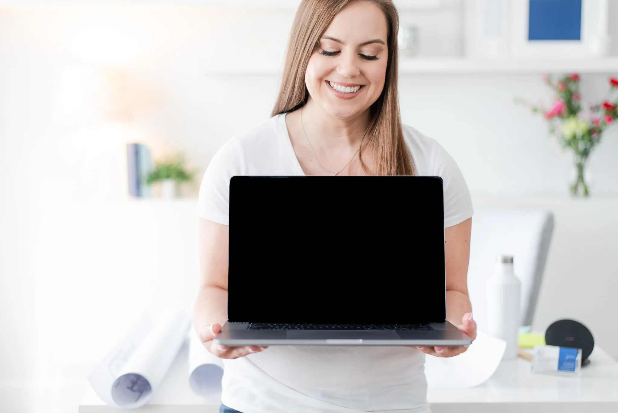 Whitney Holding Laptop Facing Outward