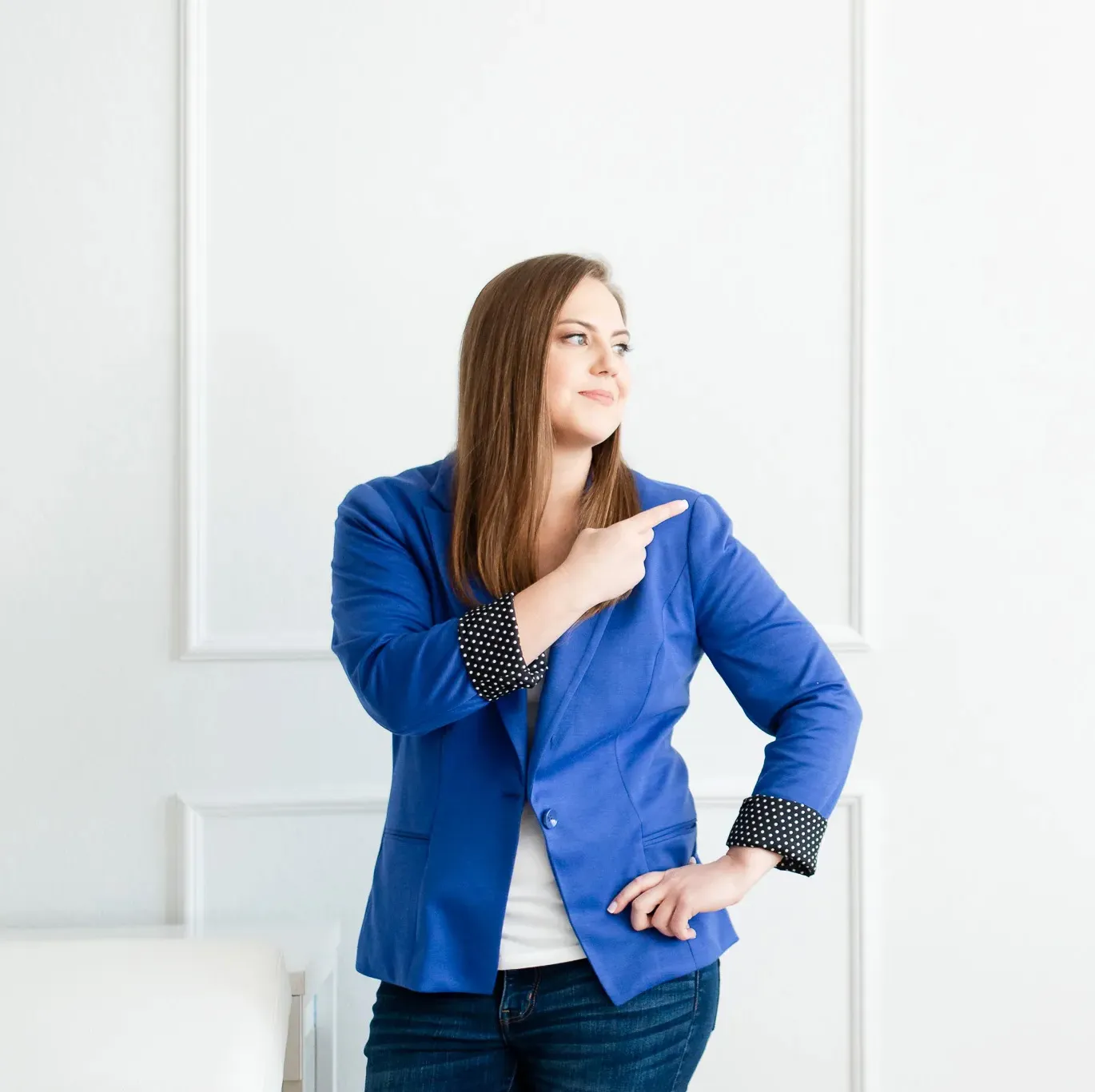Whitney in BLue Jacket Pointing Upwards as in Growth & Development