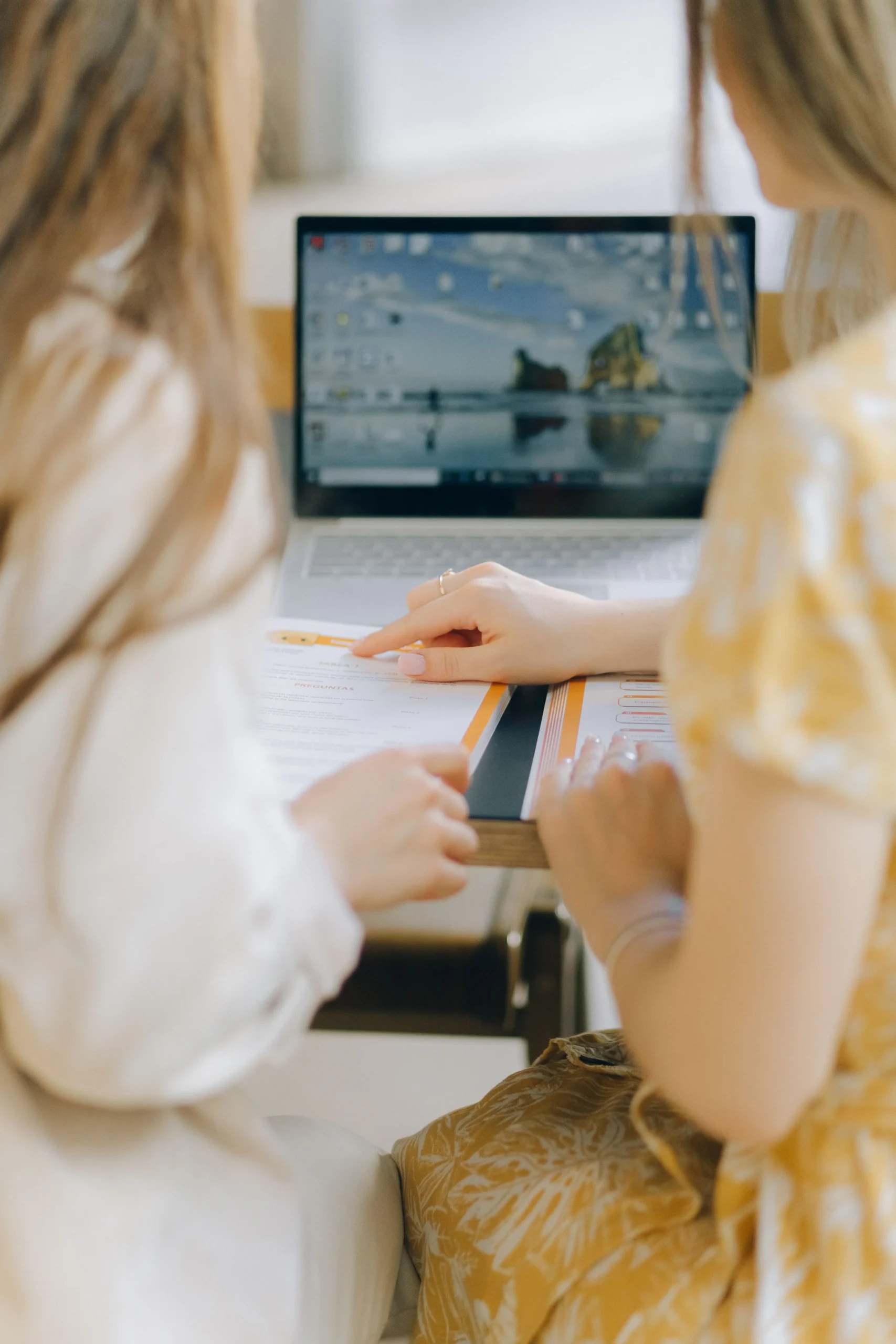 Two Women Working Together on a Laptop