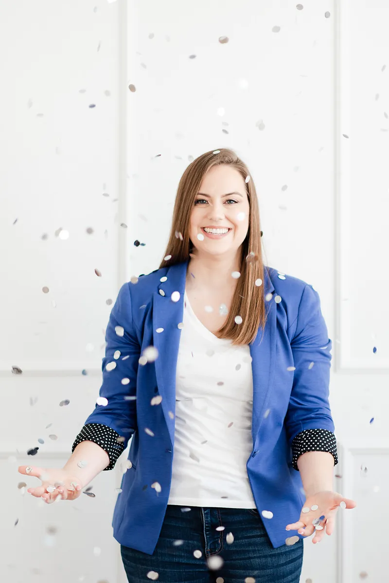 Whitney in Blue Jacket Throws and Catches Confetti