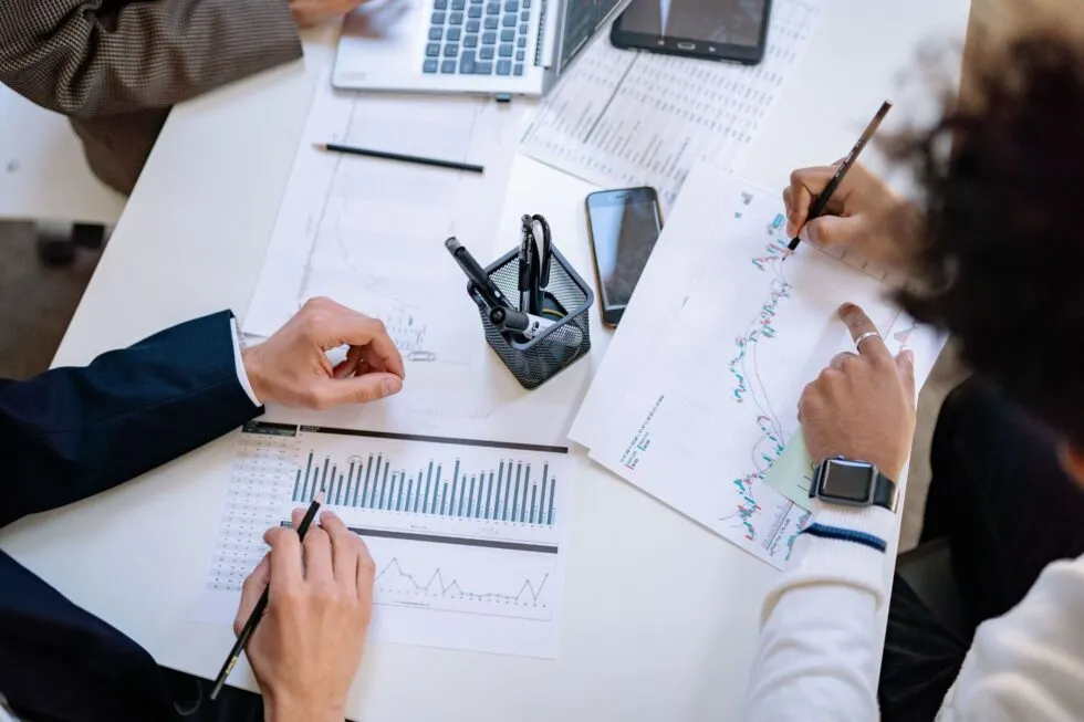 View of Individuals Working on Graph at Table