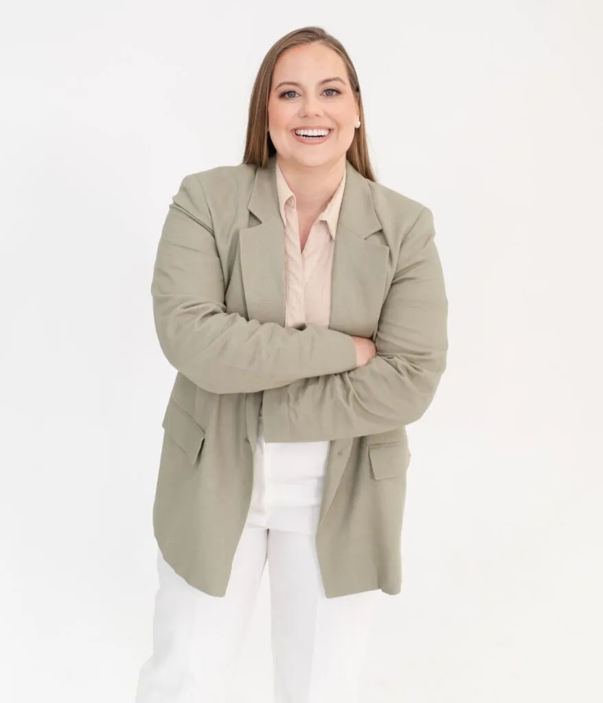 Whitney in Tan Jacket with Arms Crossed